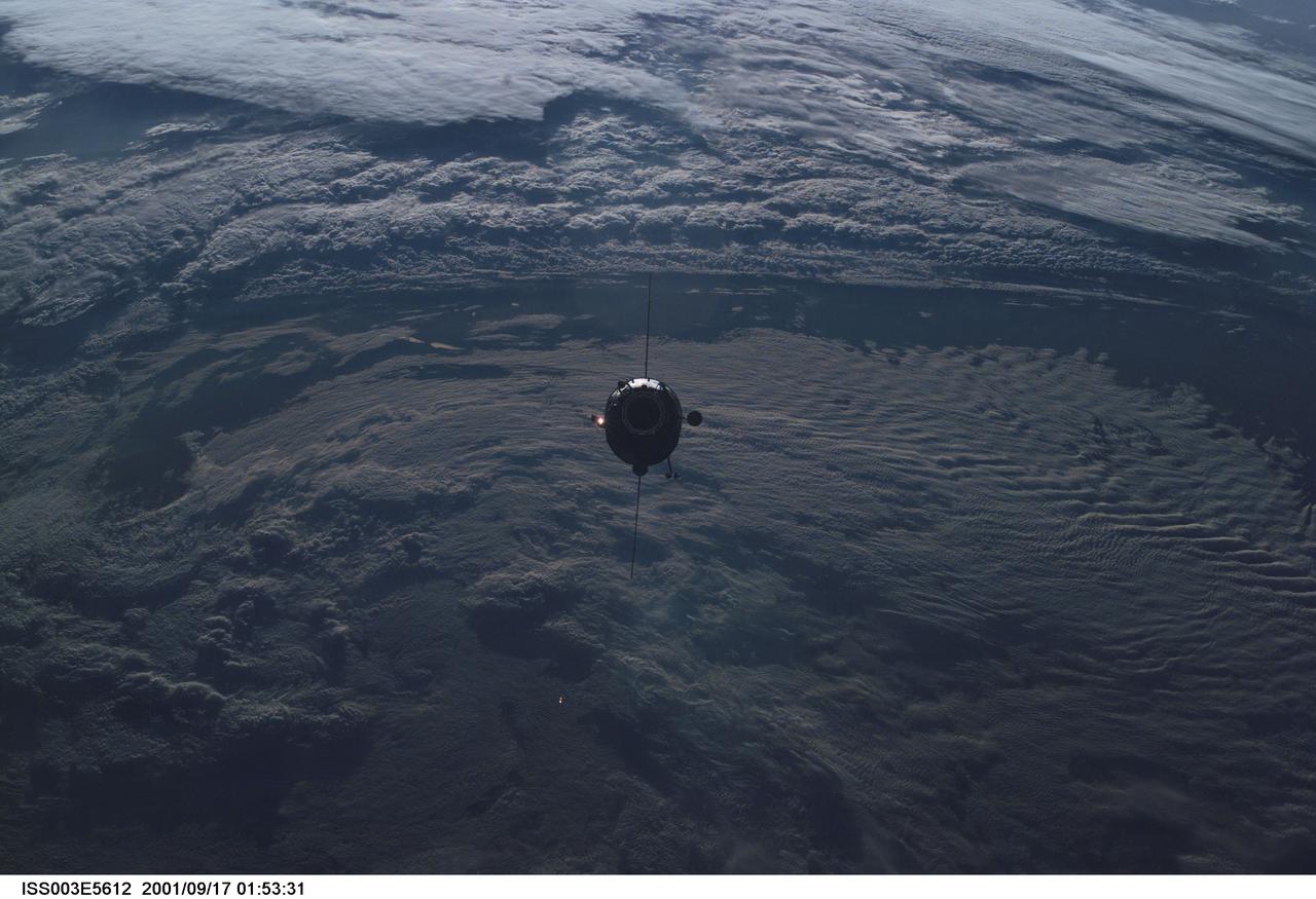 ISS003-E-5612 (17 September 2001) --- The Russian docking compartment Pirs approaches the International Space Station (ISS). The Pirs will provide a docking port for future Russian spacecraft as well as an airlock for extravehicular activities (EVA).