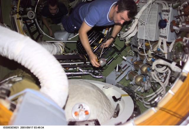 NASA image: Dezhurov removes the docking probe in Zvezda during Expedition Three