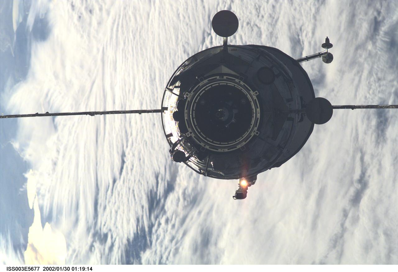 ISS003-E-5677 (16 September 2001) --- The Russian Docking Compartment, named Pirs, the Russian word for pier, approaches the International Space Station (ISS).  One of the Expedition Three crew members, using a digital still camera with a 180mm lens, recorded the image from onboard the orbital outpost. The vehicle was launched on September 14, 2001 and docking occurred on September 16.