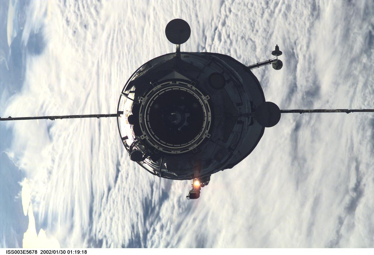 ISS003-E-5678 (16 September 2001) --- The Russian Docking Compartment, named Pirs, the Russian word for pier, approaches the International Space Station (ISS).  One of the Expedition Three crew members, using a digital still camera with a 180mm lens, recorded the image from onboard the orbital outpost. The vehicle was launched on September 14, 2001 and docking occurred on September 16.