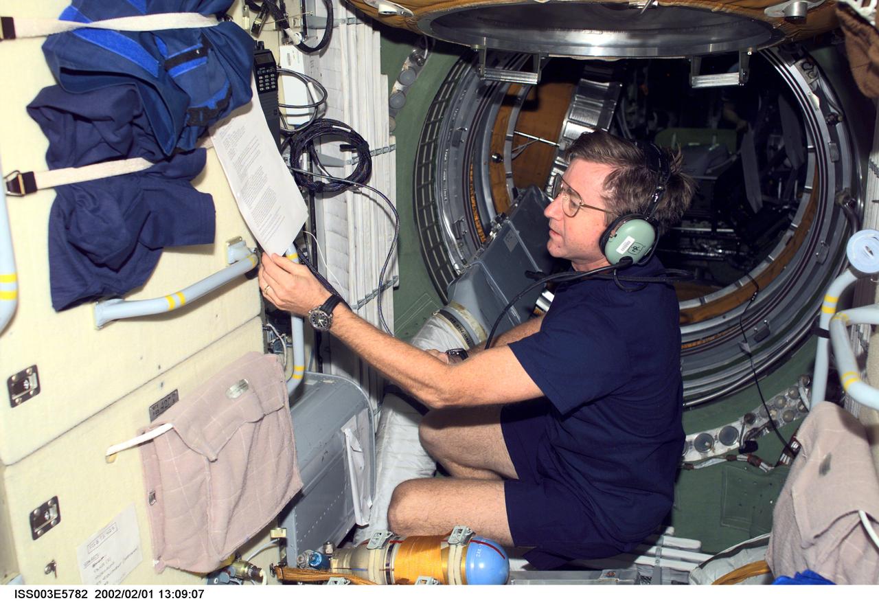 ISS003-E-5782 (September 2001) --- Astronaut Frank L. Culbertson, Jr., Expedition Three mission commander, operates the amateur radio equipment in the Zarya or functional cargo block (FGB)  of the International Space Station (ISS).  This image was taken with a digital still camera. Please note:  The date identifiers on some frames are not accurate due to a technical problem with one of the Expedition Three cameras. When a specific date is given in the text or description portion, it is correct.
