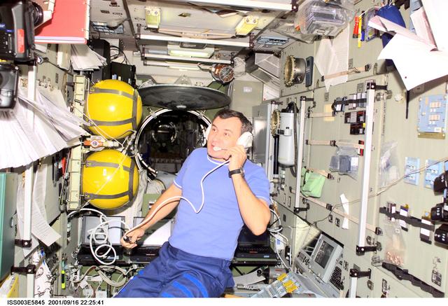 NASA image: Dezhurov uses communication equipment in the Service Module during Expedition Three