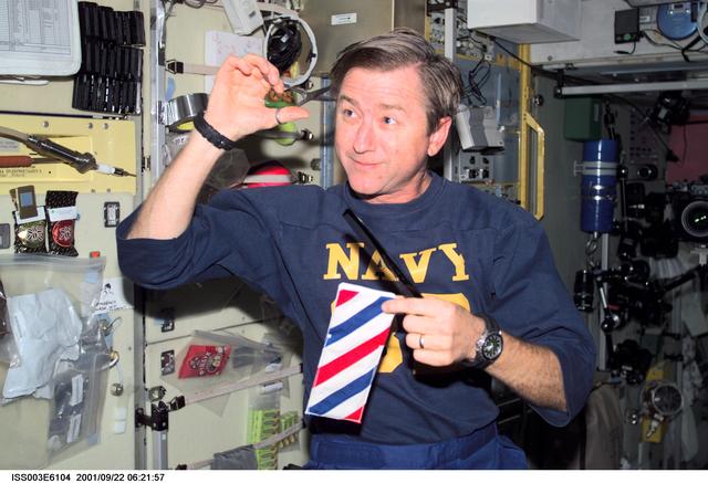 NASA image: Culbertson cuts his hair in the Service Module during Expedition Three