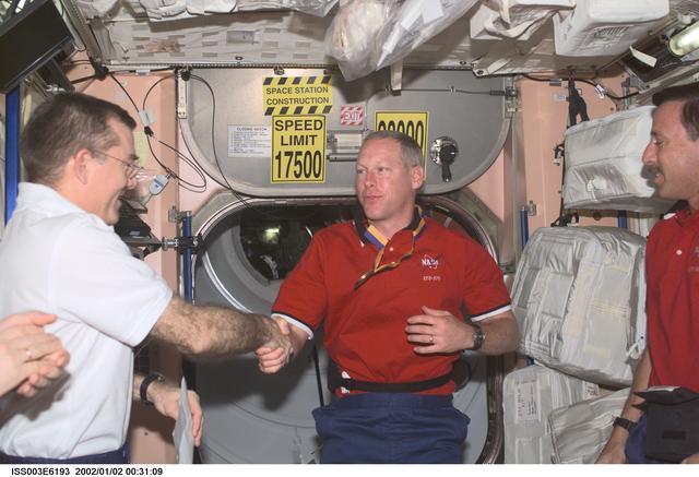 NASA image: Forrester is presented with a medal by Voss and Horowitz in Node 1