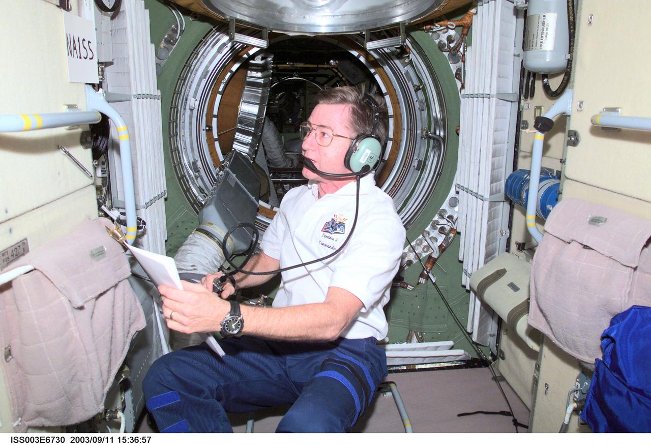 ISS003-E-6730 (October 2001) --- Astronaut Frank L. Culbertson, Jr., Expedition Three mission commander, uses a ham radio in the functional cargo block (FGB), or Zarya on the International Space Station (ISS). This image was taken with a digital still camera.