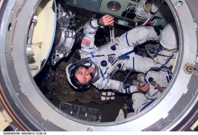 NASA image: Culbertson poses in the Soyuz spacecraft during Expedition Three