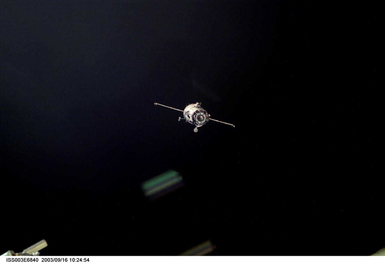 ISS003-E-6840 (23 October 2001) --- A Soyuz spacecraft approaches the International Space Station (ISS) carrying the Soyuz taxi crew, Commander Victor Afanasyev, Flight Engineer Konstantin Kozeev and French Flight Engineer Claudie Haignere for an eight-day stay on the station. Afanasyev and Kozeev represent Rosaviakosmos, and Haignere represents ESA, carrying out a flight program for CNES, the French Space Agency, under a commercial contract with the Russian Aviation and Space Agency. This image was taken with a digital still camera.