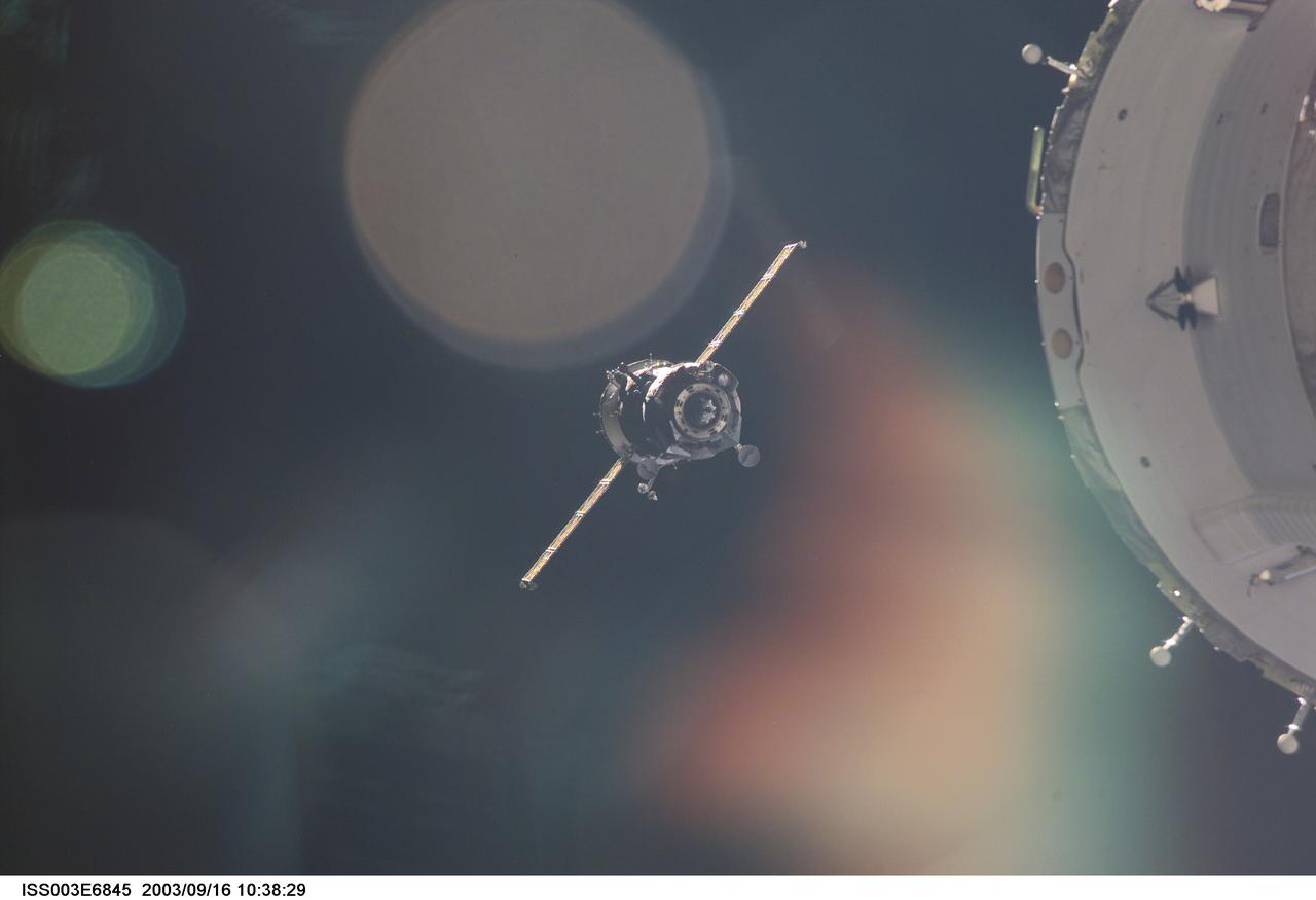 ISS003-E-6845 (23 October 2001) --- A Soyuz spacecraft approaches the International Space Station (ISS) carrying the Soyuz taxi crew, Commander Victor Afanasyev, Flight Engineer Konstantin Kozeev and French Flight Engineer Claudie Haignere for an eight-day stay on the station. Afanasyev and Kozeev represent Rosaviakosmos, and Haignere represents ESA, carrying out a flight program for CNES, the French Space Agency, under a commercial contract with the Russian Aviation and Space Agency. This image was taken with a digital still camera.