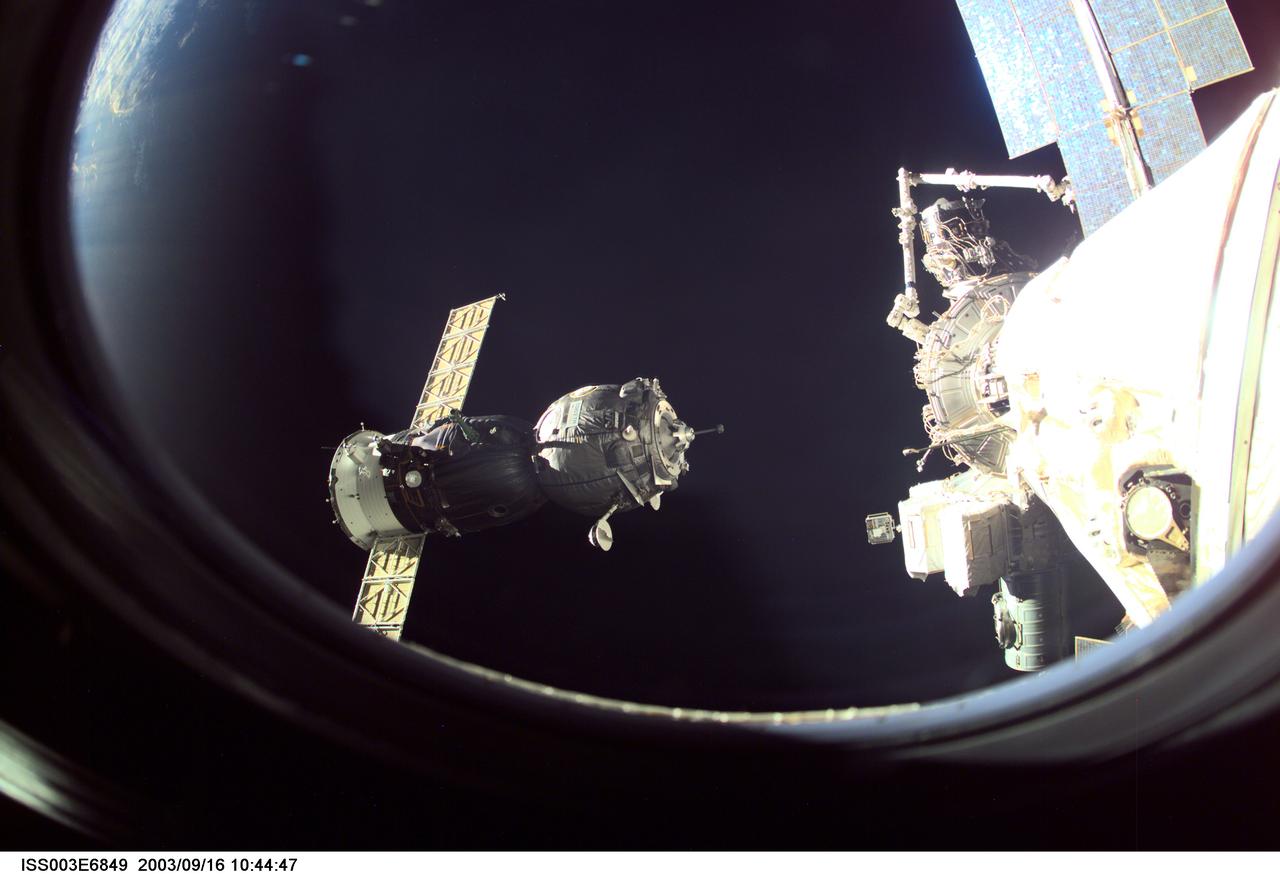 ISS003-E-6849 (23 October 2001) --- A Soyuz spacecraft approaches the International Space Station (ISS) carrying the Soyuz taxi crew, Commander Victor Afanasyev, Flight Engineer Konstantin Kozeev and French Flight Engineer Claudie Haignere for an eight-day stay on the station. Afanasyev and Kozeev represent Rosaviakosmos, and Haignere represents ESA, carrying out a flight program for CNES, the French Space Agency, under a commercial contract with the Russian Aviation and Space Agency. This image was taken with a digital still camera.