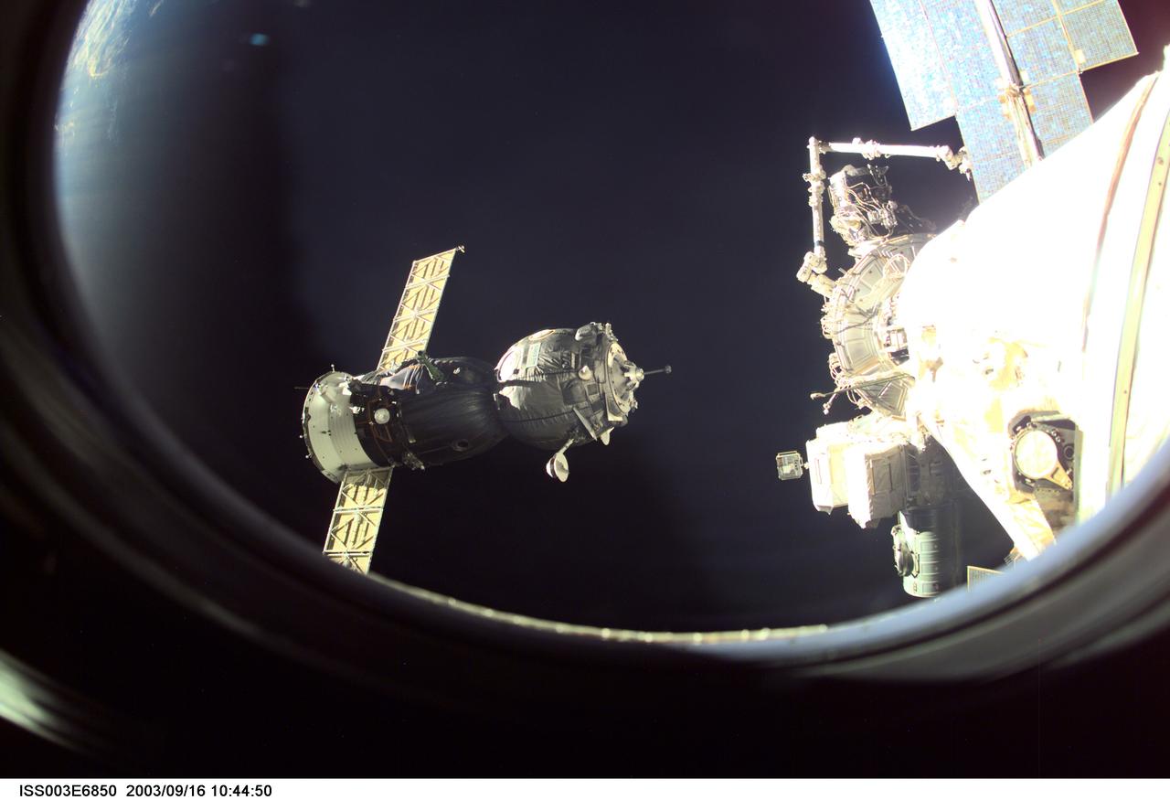 ISS003-E-6850 (23 October 2001) --- A Soyuz spacecraft approaches the International Space Station (ISS) carrying the Soyuz taxi crew, Commander Victor Afanasyev, Flight Engineer Konstantin Kozeev and French Flight Engineer Claudie Haignere for an eight-day stay on the station. Afanasyev and Kozeev represent Rosaviakosmos, and Haignere represents ESA, carrying out a flight program for CNES, the French Space Agency, under a commercial contract with the Russian Aviation and Space Agency. This image was taken with a digital still camera.