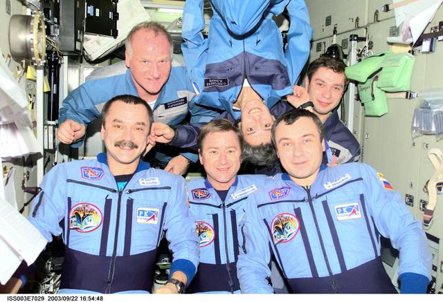 NASA image: Taxi and Expedition Three crews prepare for a group photo in Zvezda during Expedition Three