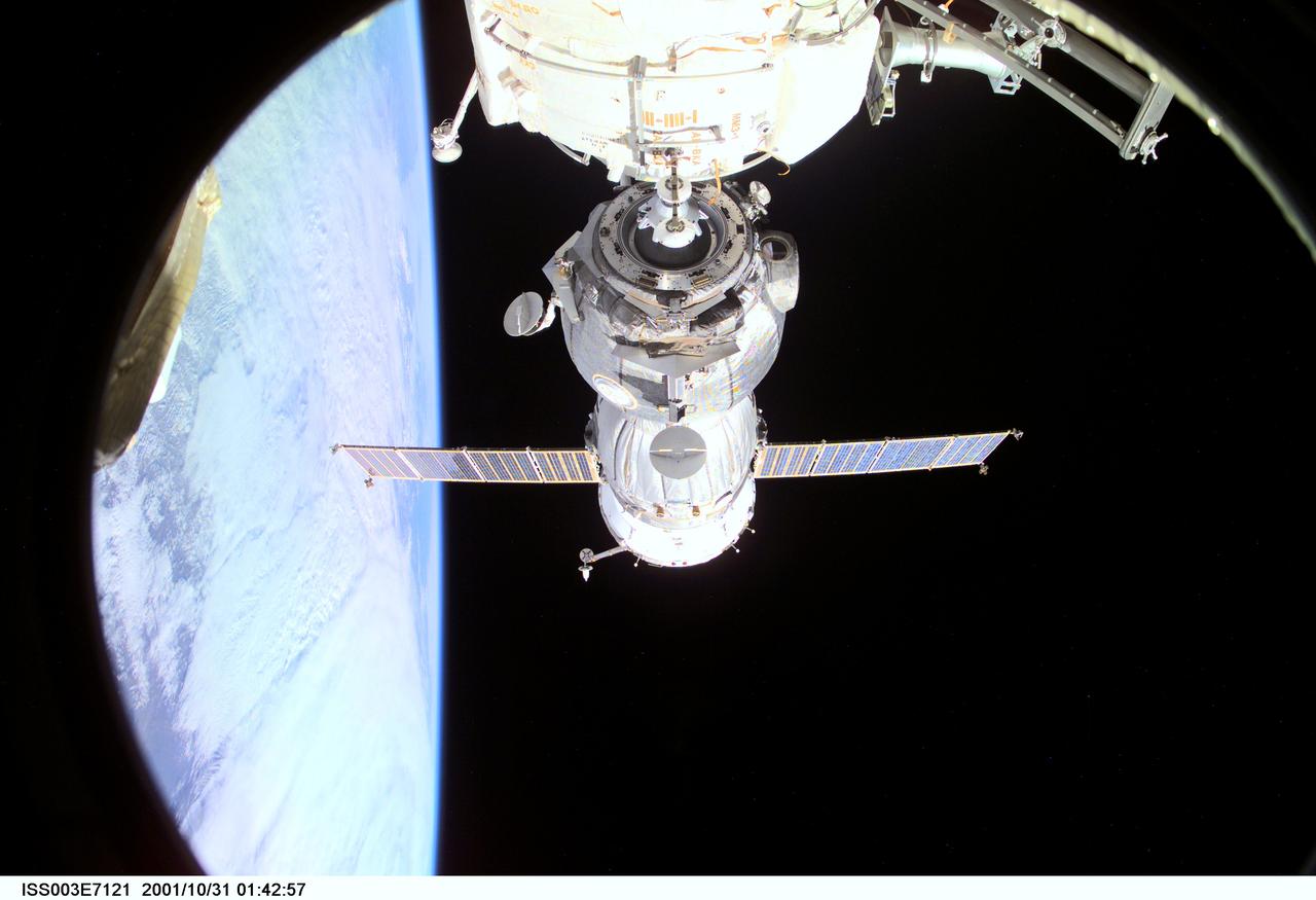 ISS003-E-7121 (31 October 2001) --- Backdropped by Earth’s horizon and the blackness of space, a Soyuz spacecraft undocks from the International Space Station (ISS) carrying the Soyuz taxi crew, Commander Victor Afanasyev, Flight Engineer Konstantin Kozeev and French Flight Engineer Claudie Haignere, ending their eight-day stay on the station. Afanasyev and Kozeev represent Rosaviakosmos, and Haignere represents ESA, carrying out a flight program for CNES, the French Space Agency, under a commercial contract with the Russian Aviation and Space Agency. This image was taken with a digital still camera.