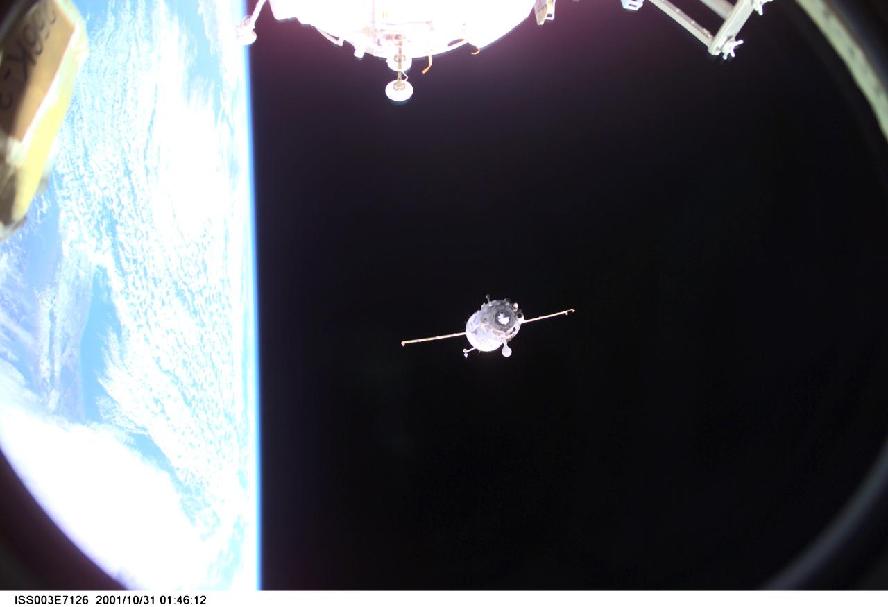 ISS003-E-7126 (31 October 2001) --- Backdropped by Earth’s horizon and the blackness of space, a Soyuz spacecraft undocks from the International Space Station (ISS) carrying the Soyuz taxi crew, Commander Victor Afanasyev, Flight Engineer Konstantin Kozeev and French Flight Engineer Claudie Haignere, ending their eight-day stay on the station. Afanasyev and Kozeev represent Rosaviakosmos, and Haignere represents ESA, carrying out a flight program for CNES, the French Space Agency, under a commercial contract with the Russian Aviation and Space Agency. This image was taken with a digital still camera.