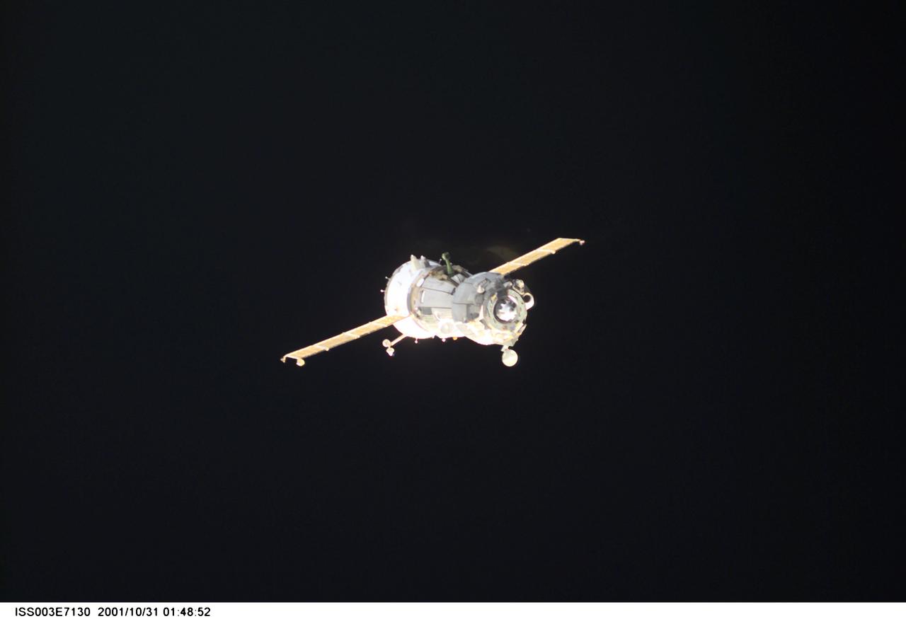 ISS003-E-7130 (31 October 2001) --- A Soyuz spacecraft departs from the International Space Station (ISS) carrying the Soyuz taxi crew, Commander Victor Afanasyev, Flight Engineer Konstantin Kozeev and French Flight Engineer Claudie Haignere, ending their eight-day stay on the station. Afanasyev and Kozeev represent Rosaviakosmos, and Haignere represents ESA, carrying out a flight program for CNES, the French Space Agency, under a commercial contract with the Russian Aviation and Space Agency. This image was taken with a digital still camera.