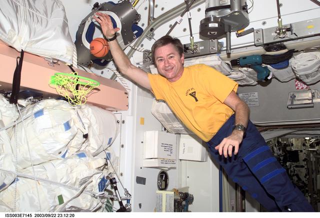 NASA image: Culbertson slam dunks a mini basketball in Node 1 during Expedition Three