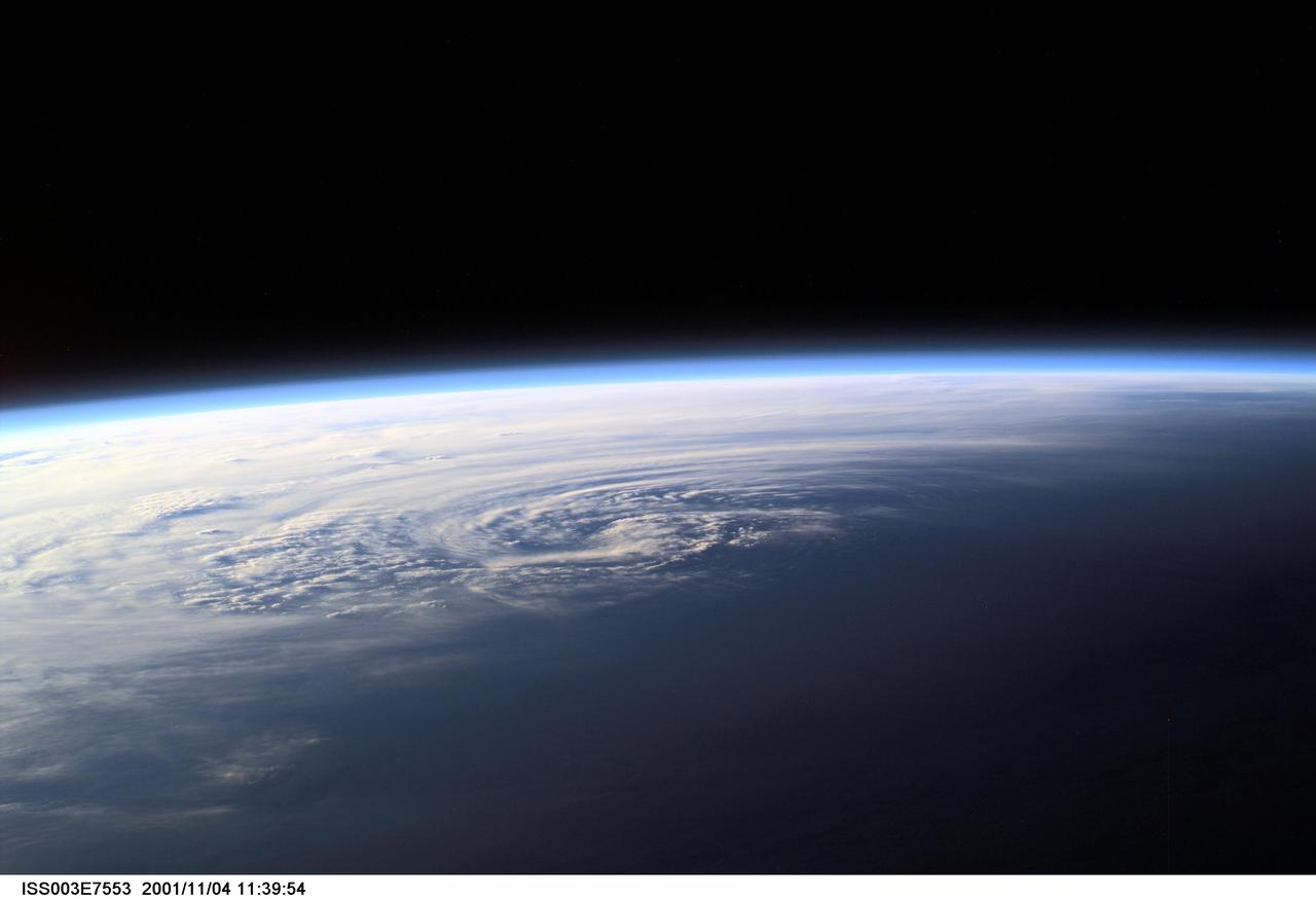 ISS003-E-7553 (4 November 2001) --- Pictured near Earth's horizon, Hurricane Michelle made landfall on Cuba on November 4, 2001, with sustained winds of 135 miles per hour. The most signficant impact was in the Matanzas province near Pinar del Rio. This scene was captured by one of the Expedition Three crew members aboard the International Space Station (ISS)using a digital still camera.