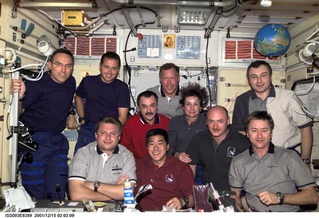 Expedition Three, Expedition Four and STS-108 crews pose for group portrait in Zvezda