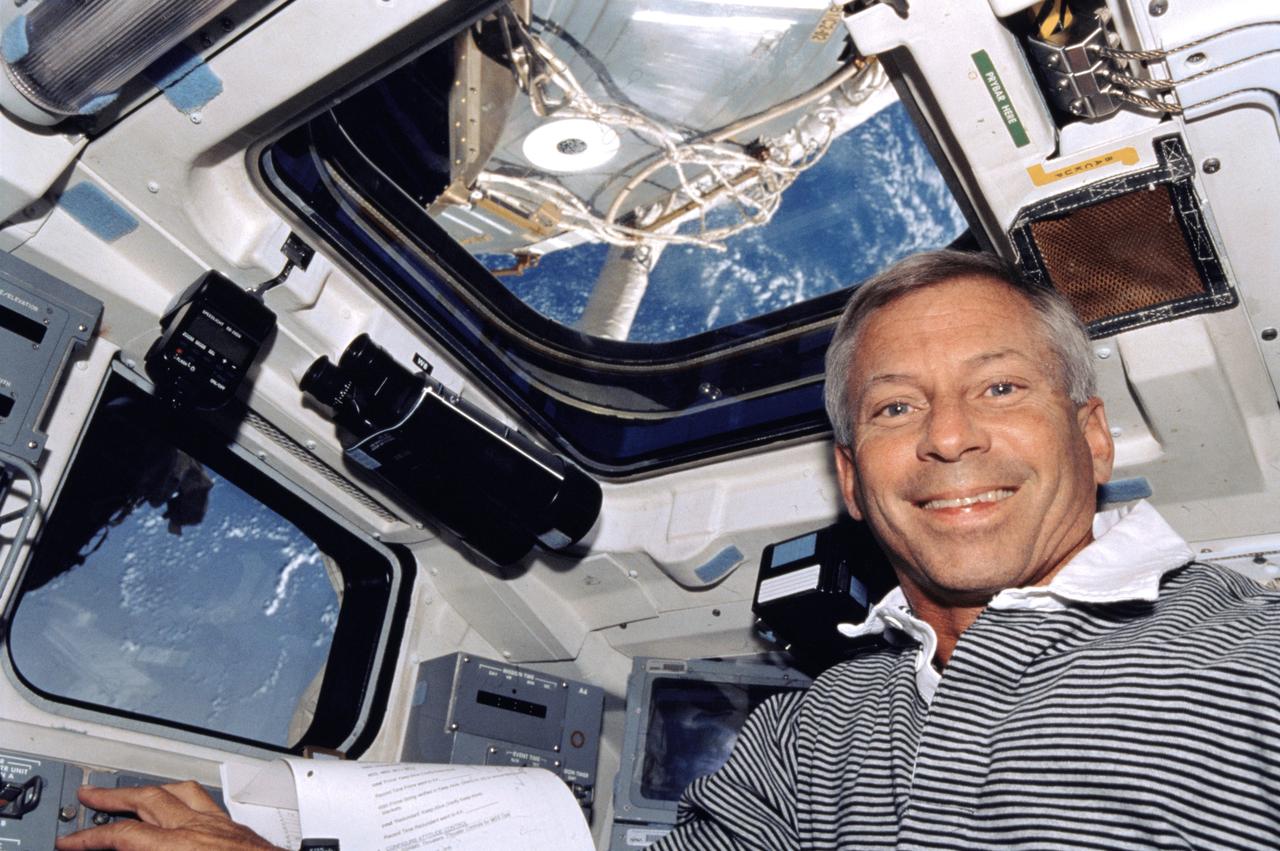 ISS004-327-017 (5-19 June 2002) --- Astronaut Kenneth D. Cockrell, STS-111 mission commander, is photographed on the aft flight deck of the Space Shuttle Endeavour while docked with the International Space Station (ISS).