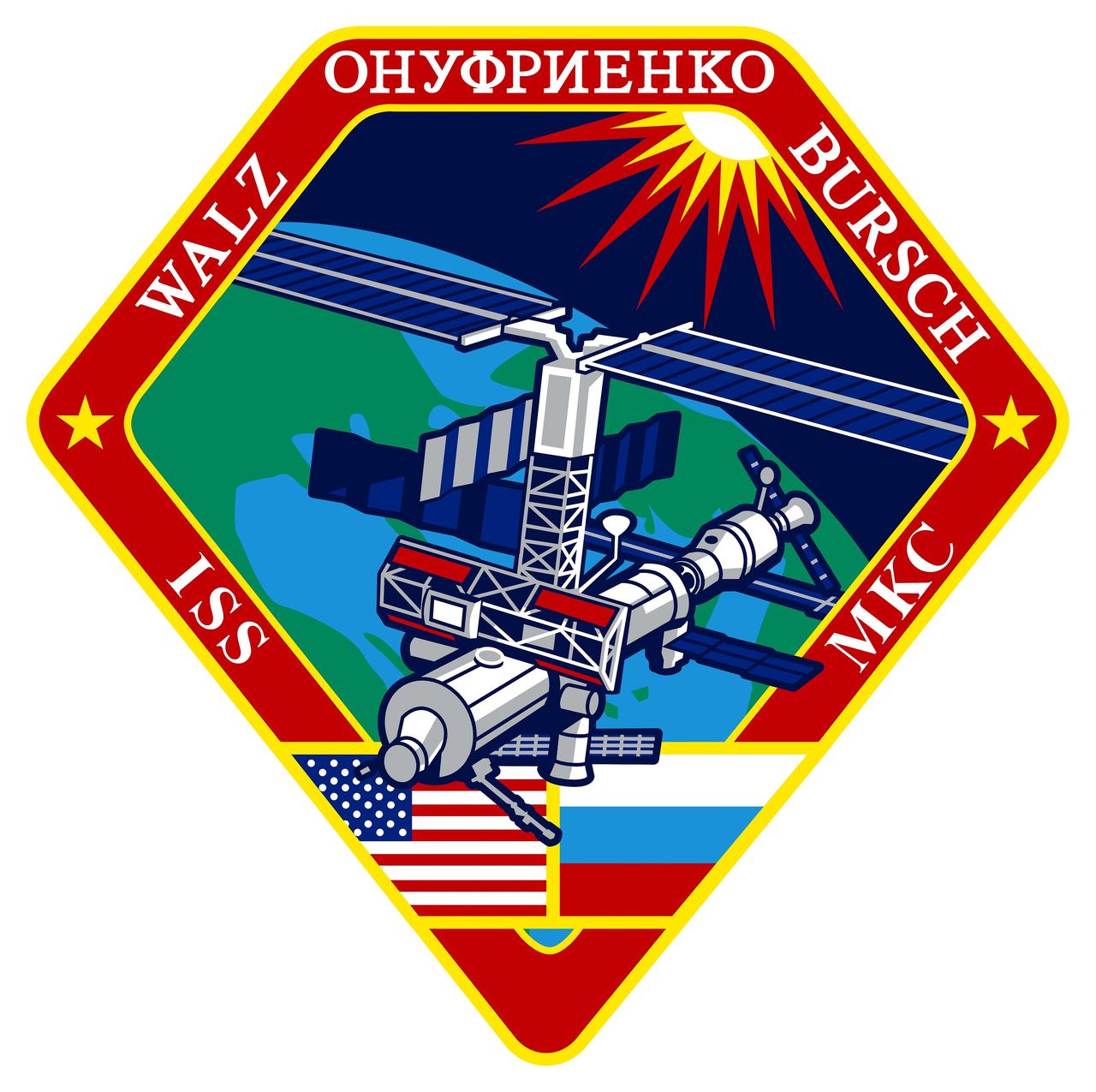 ISS004-S-001 (August 2001) --- The International Space Station (ISS) Expedition 4 crew patch has an overall diamond shape, showing the &#0147;diamond in the rough&#0148; configuration of the Station during expedition 4. The red hexagonal shape with stylized American and Russian flags represents the cross-sectional view of the S0 truss segment, which the crew will attach to the U.S. Lab Destiny. The persistent Sun shining on the Earth and Station represents the constant challenges that the crew and ground support team will face every day while operating the International Space Station, while shedding new light through daily research. The green portion of the Earth represents the fourth color in the visible spectrum and the black void of space represents humankind&#0146;s constant quest to explore the unknown.    The NASA insignia design for Shuttle flights is reserved for use by the astronauts and for other official use as the NASA Administrator may authorize. Public availability has been approved only in the forms of illustrations by the various news media. When and if there is any change in this policy, which is not anticipated, the change will be publicly announced.