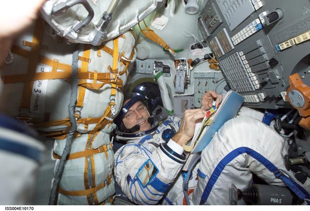 NASA image: Walz seated in the Soyuz 3 capsule during Expedition Four rescue craft relocation