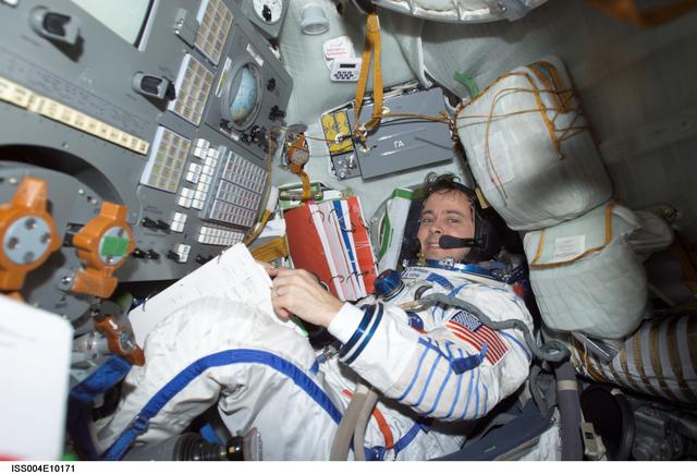 NASA image: Bursch seated in the Soyuz 3 capsule during Expedition Four rescue craft relocation