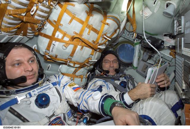 NASA image: Onufrienko and Walz seated in the Soyuz 3 capsule during Expedition Four rescue craft relocation