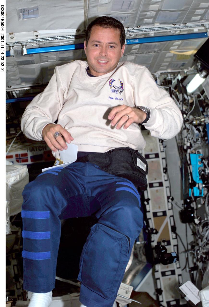 ISS004-E-5004 (December 2001) --- Astronaut Daniel W. Bursch, Expedition Four flight engineer, floats in the Destiny laboratory on the International Space Station (ISS). The image was taken with a digital still camera.