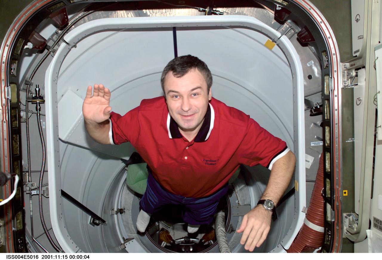 ISS004-E-5016 (December 2001) --- Cosmonaut Vladimir N. Dezhurov, Expedition Three flight engineer, floats through the Pressurized Mating Adapter 2 (PMA-2) on the International Space Station (ISS). A crewmate in the Destiny laboratory captured the image on a digital still camera.