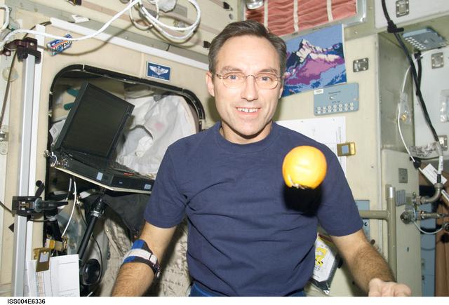 NASA image: Walz with fresh fruit in the Zvezda SM, Expedition Four