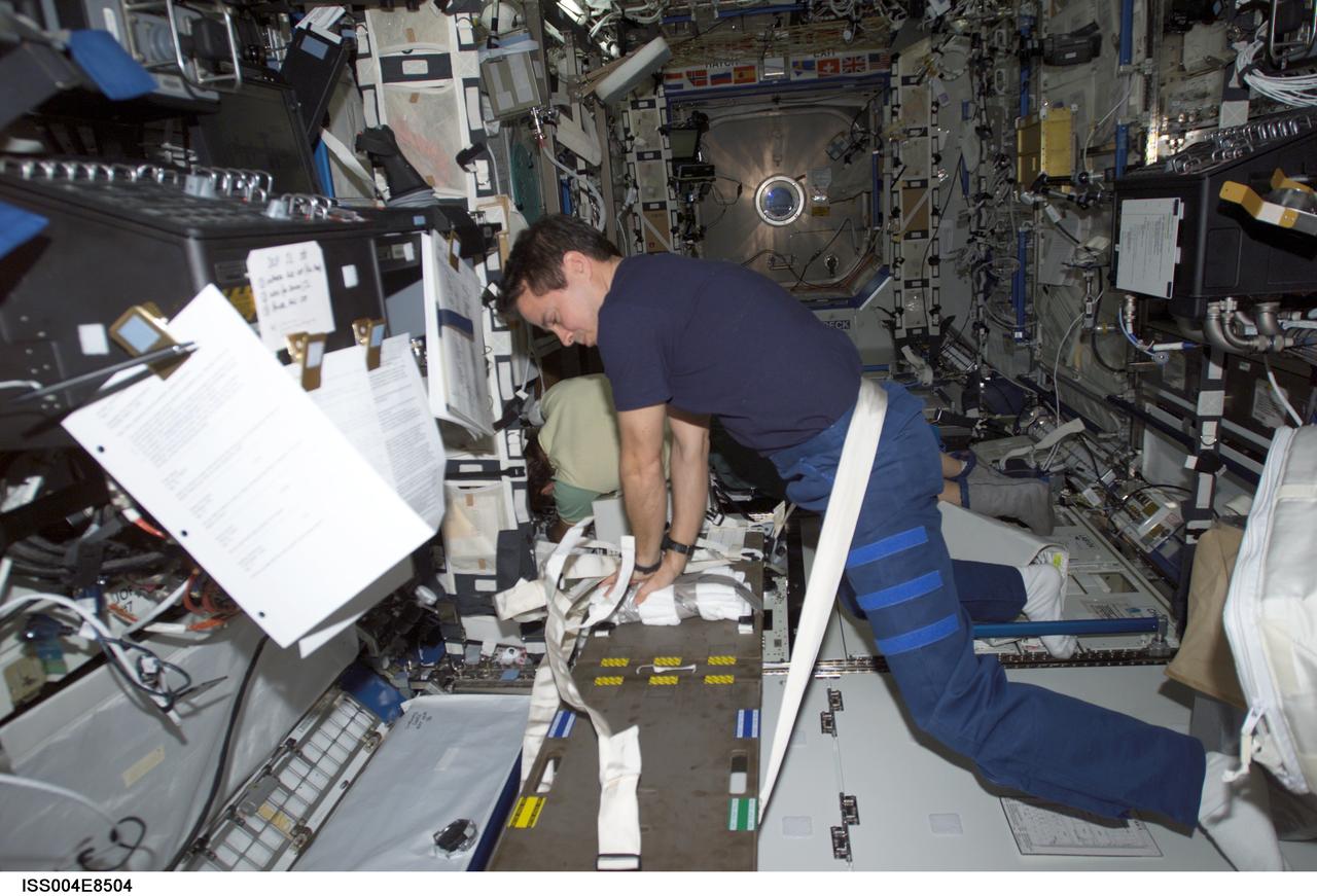 ISS004-E-8504 (11 March 2002) --- Astronaut Daniel W. Bursch, Expedition Four flight engineer, performs cardio-pulmonary resuscitation (CPR) on a jerry-rigged “human chest” dummy in the Destiny laboratory on the International Space Station (ISS). The image was taken with a digital still camera.