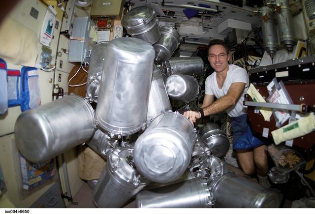 NASA image: Walz catalogs water containers in the Zvezda SM during Expedition Four