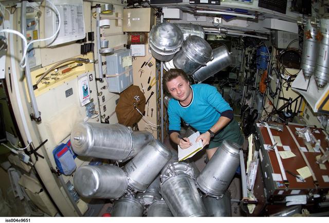 NASA image: Onufrienko catalogs water containers in the Zvezda SM during Expedition Four