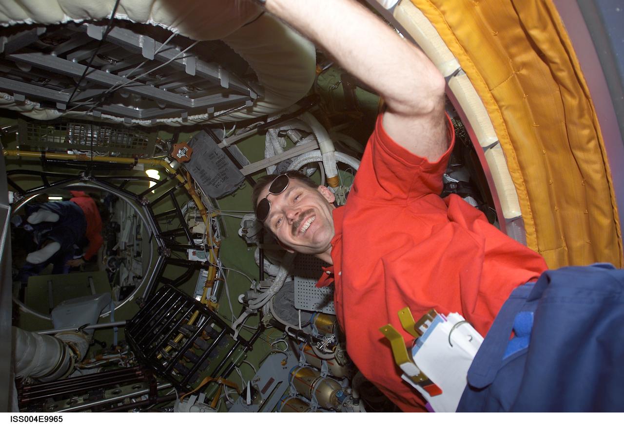 ISS004-E-9965 (10 April 2002) --- Astronaut Steven L. Smith, STS-110 mission specialist, enters the Zvezda Service Module&#0146;s transfer compartment on the International Space Station (ISS).