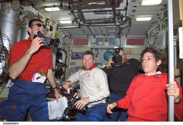 NASA image: STS-110 crewmembers gather in the Zvezda SM on first day of joint OPS with EXP Four