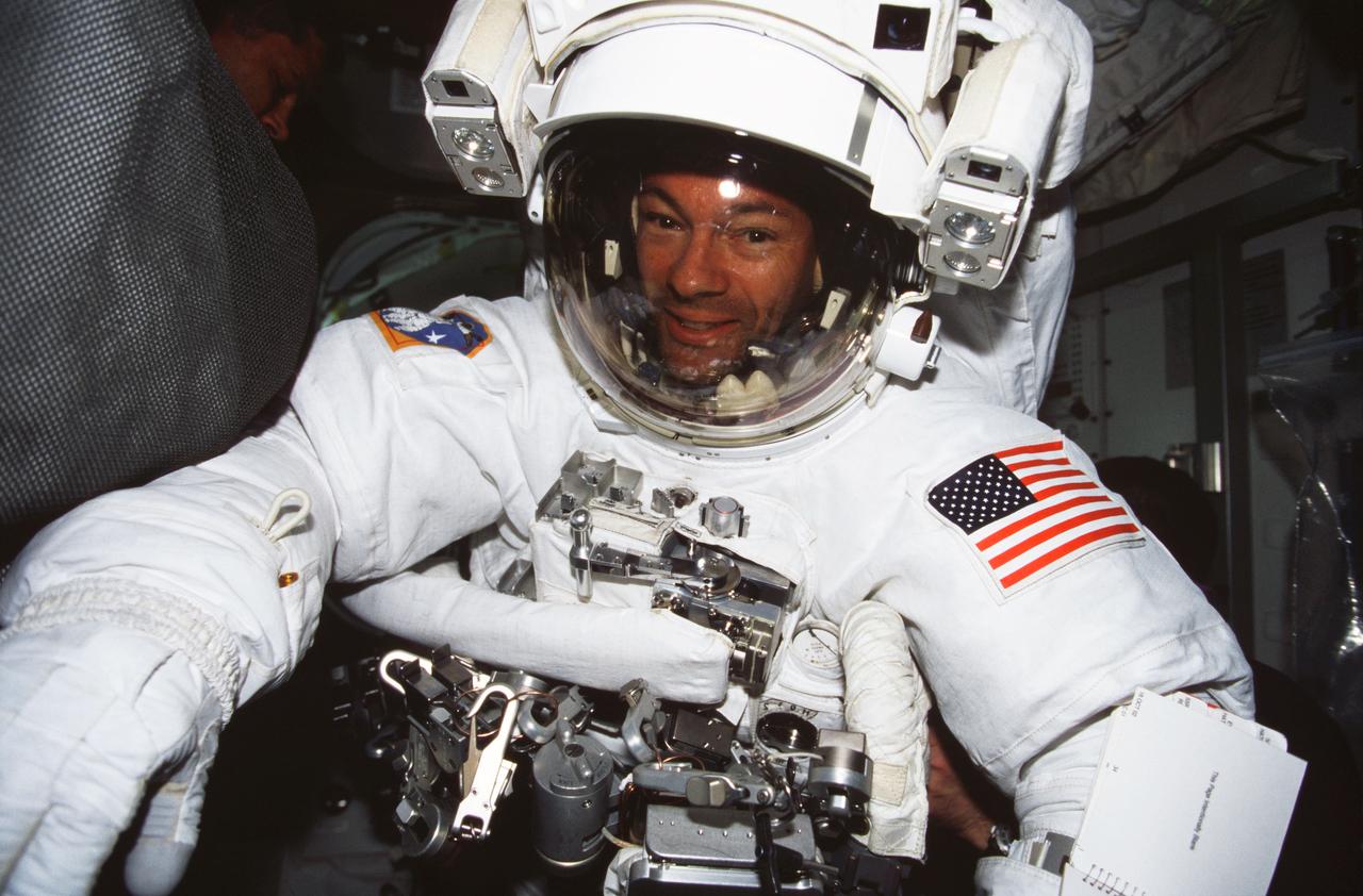 ISS005-366-029 (23 November &#0150; 7 December 2002) --- Astronaut Michael E. Lopez-Alegria, STS-113 mission specialist, is pictured in the Quest Airlock on the International Space Station (ISS) after participating in one of the mission&#0146;s three scheduled spacewalks. Lopez-Alegria is wearing his Extravehicular Mobility Unit (EMU) spacesuit.