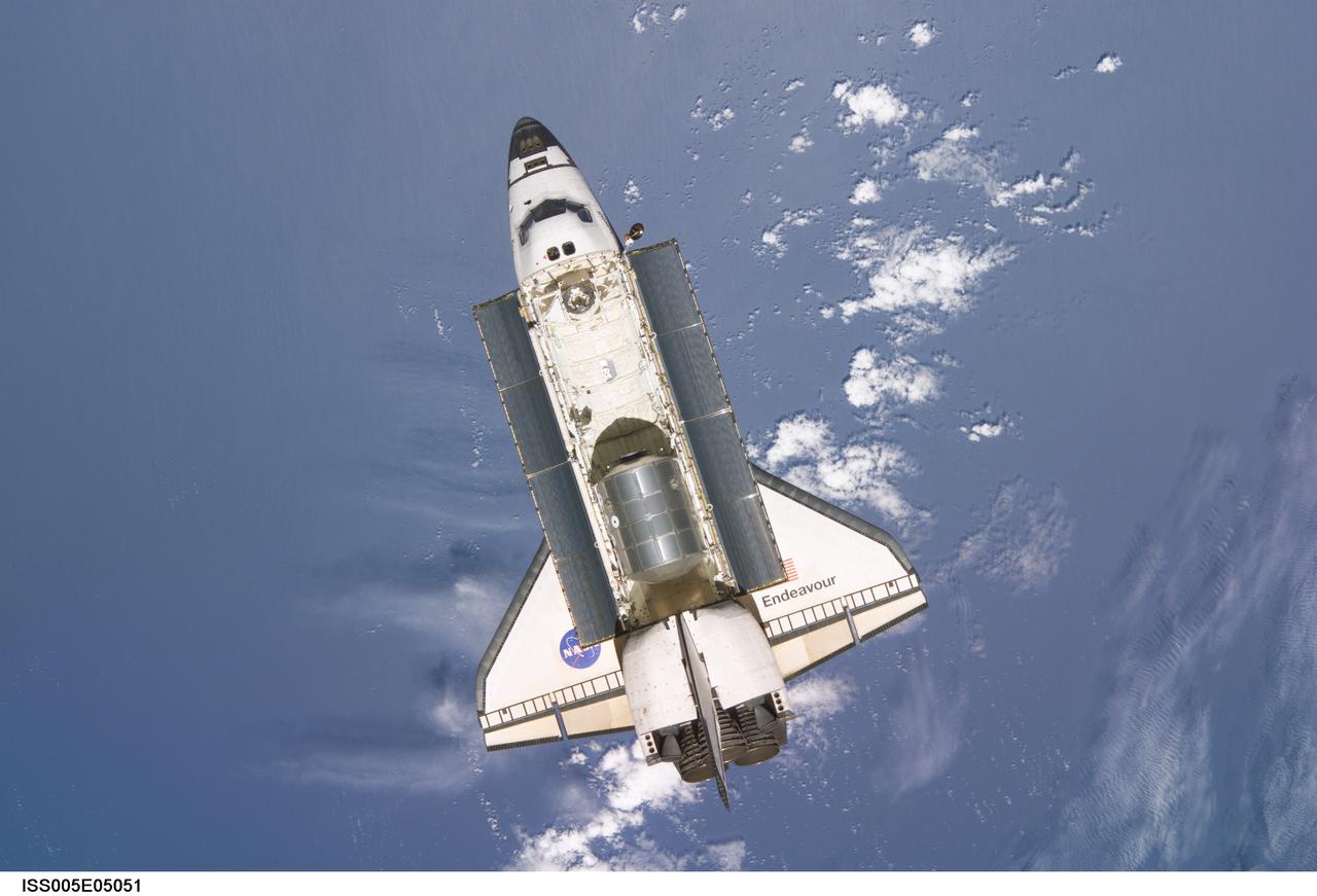 ISS005-E-05051 (15 June 2002) --- Backdropped by a blue and white Earth, the Space Shuttle Endeavour is photographed shortly after its separation from the International Space Station (ISS). The undocking occurred at 9:32 a.m. (CDT) on June 15, 2002.