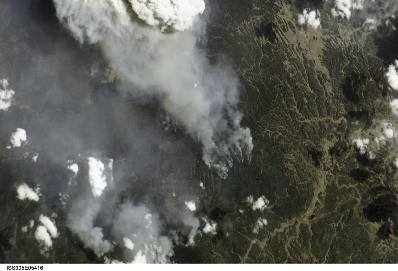 ISS005-E-5416  (18 June 2002) --- This photograph, taken by the International Space Station&#0146;s Expedition Five crew on June 18, 2002, shows the Hayman Fire burning in the foothills southwest of Denver. Astronauts use a variety of lenses and look angles as their orbits pass over wildfires to document the long-distance movements of smoke from the fires as well as details of the burning areas. In this detail view, you can see multiple smoke source points as the fire moves across the rough terrain. The link  [<http://eol.jsc.nasa.gov/scripts/sseop/photo.pl?mission=ISS005&roll=E&frame=5416> ] was provided by the Earth Sciences and Image Analysis Laboratory at Johnson Space Center. Additional images taken by astronauts and cosmonauts can be viewed at the NASA-JSC Gateway to Astronaut Photography of Earth [link to <http://eol.jsc.nasa.gov/> ].