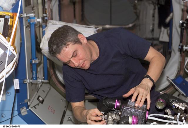 NASA image: Korzun working on TCS in the U.S. Laboratory during Expedition Five on the ISS