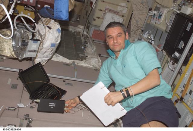 NASA image: Korzun working on laptop computer in the SM taken during Expedition Five on the ISS