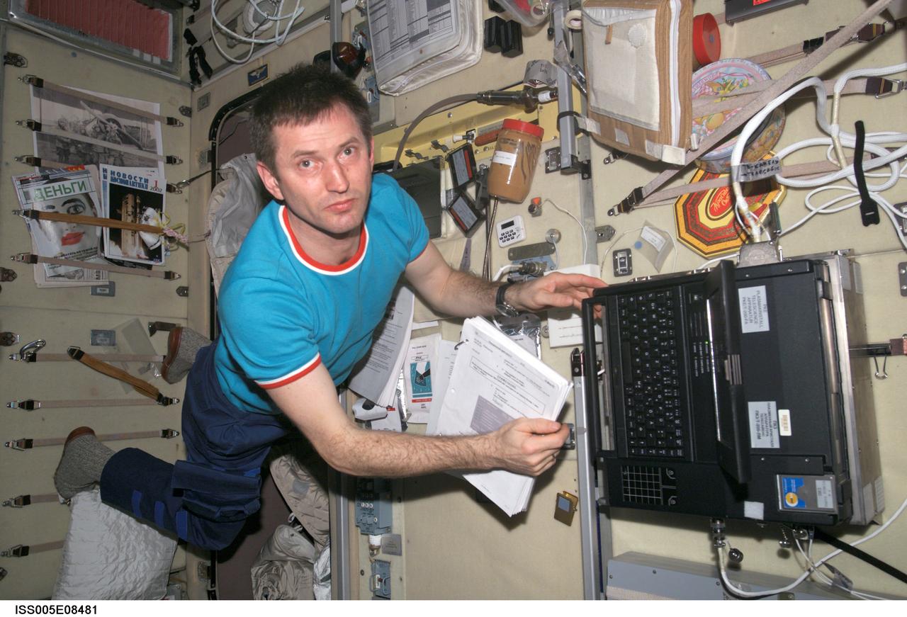 ISS005-E-08481 (1 August 2002) --- Cosmonaut Sergei Y. Treschev, Expedition Five flight engineer, works in the Zvezda Service Module on the International Space Station (ISS). Treschev represents Rosaviakosmos.