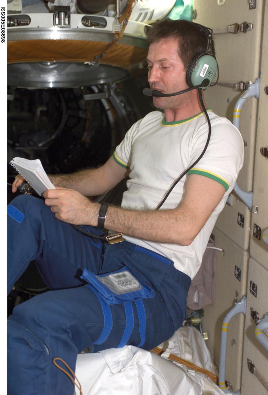 ISS005-E-08698 (6 August 2002) --- Cosmonaut Sergei Y. Treschev, Expedition Five flight engineer, uses an amateur radio in the functional cargo block (FGB) on the International Space Station (ISS). Treschev represents Rosaviakosmos.