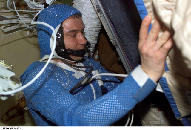 NASA image: Korzun attired in his LCVG prepares for an EVA in the Pirs Docking Compartment