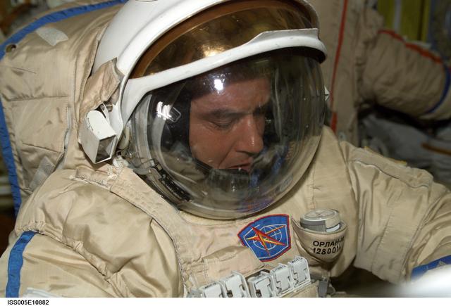 NASA image: Korzun attired in his Russian EVA Orlan suit prepares for an EVA in the Pirs Docking Compartment