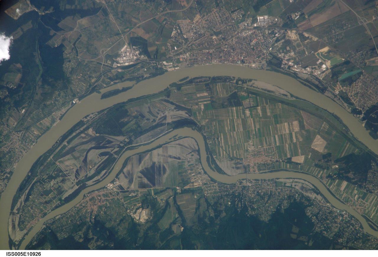 ISS005-E-10926 (23 August 2002) --- This is the second of two images recently released by the Earth Sciences and Image Analysis Laboratory at Johnson Space Center, showing some of the devastating late summer 2002 European flooding.  The images were captured by astronauts using a digital still camera onboard the International Space Station (ISS).  The photographs show flooding around the Danube Bend area just north of Budapest near the city of V&#0225;c, Hungary.  The flood peaked in Budapest  four days before this photo was  made, on August 19, at about 8.5 meters (28 feet), exceeding the previous 1965 flood record.  Water had begun to recede when this image was made.  Image no. ISS005-E-10000 shows the area four days earlier.