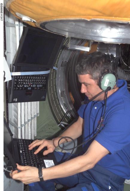 NASA image: Korzun uses an amateur radio in the FGB during Expedition Five on the ISS