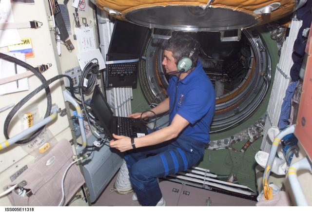 NASA image: Korzun uses an amateur radio in the FGB during Expedition Five on the ISS