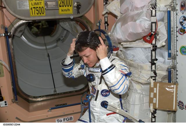 NASA image: Whitson wearing Russian Sokol suit in the FGB during Expedition Five on the ISS