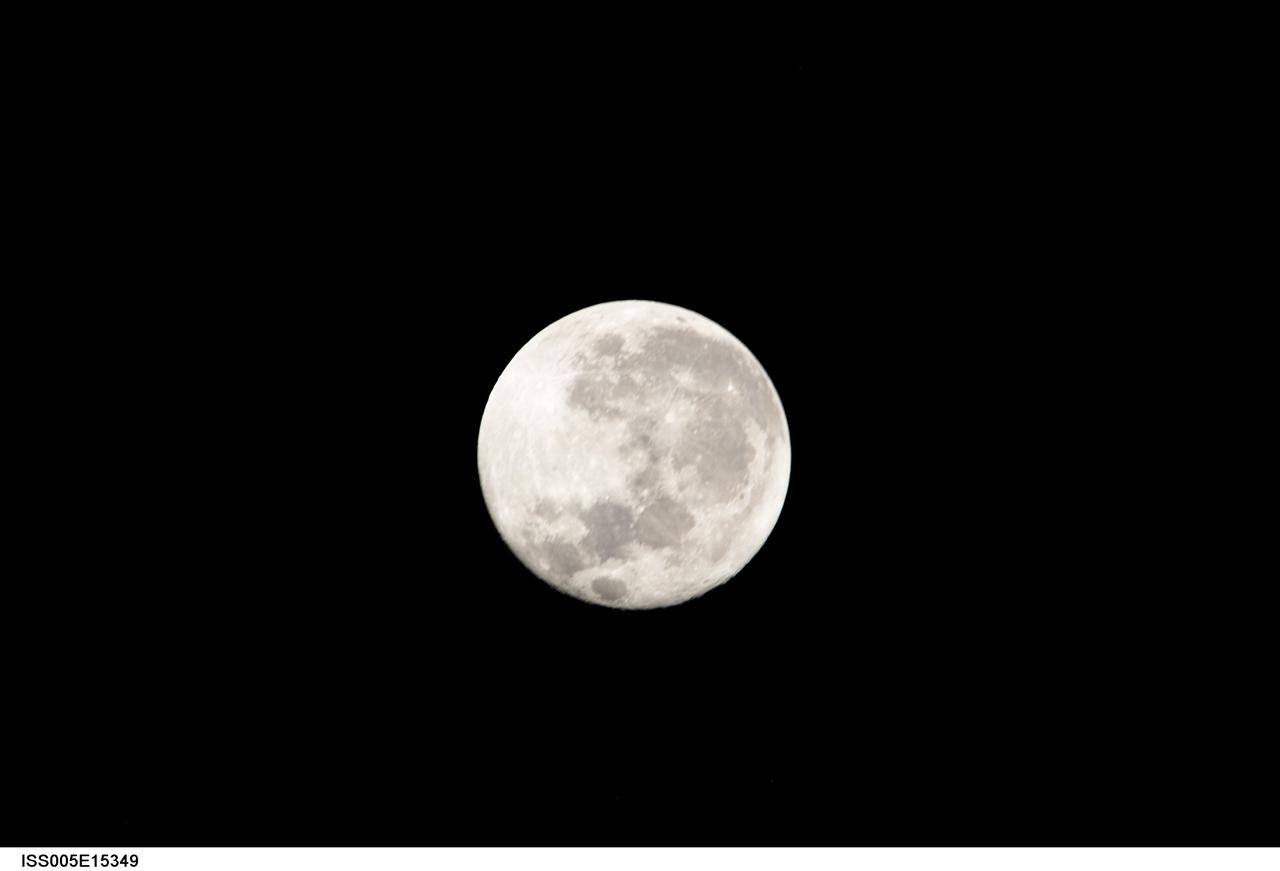 ISS005-E-15349 (22 September 2002) --- View of a full Moon photographed by one of the crewmembers aboard the International Space Station (ISS) for Expedition Five.