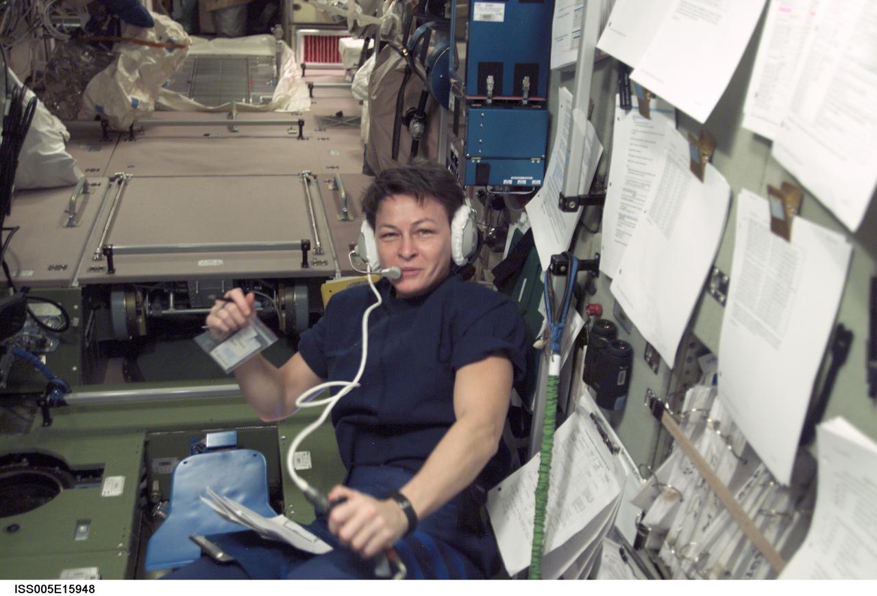 ISS005-E-15948 (2 October 2002) --- Astronaut Peggy A. Whitson, Expedition Five flight engineer, uses a communication system in the Zvezda Service Module on the International Space Station (ISS).