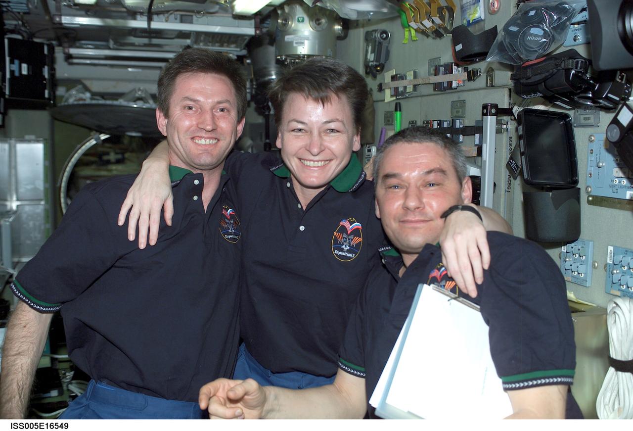ISS005-E-16549 (9 October 2002) --- The Expedition Five crewmembers were photographed in the Zvezda Service Module on the International Space Station (ISS). From the right are cosmonaut Valery G. Korzun, mission commander, astronaut Peggy A. Whitson and cosmonaut Sergei Y. Treschev, both flight engineers. Korzun and Treschev represent Rosaviakosmos.